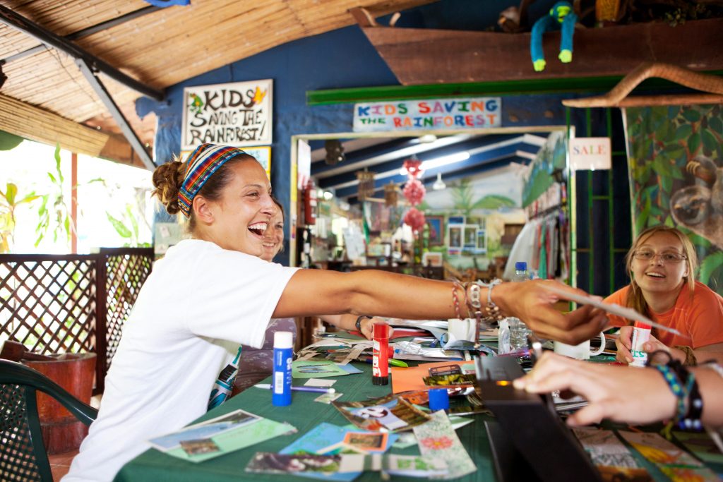 Women enjoying during working at table for charity and relief work