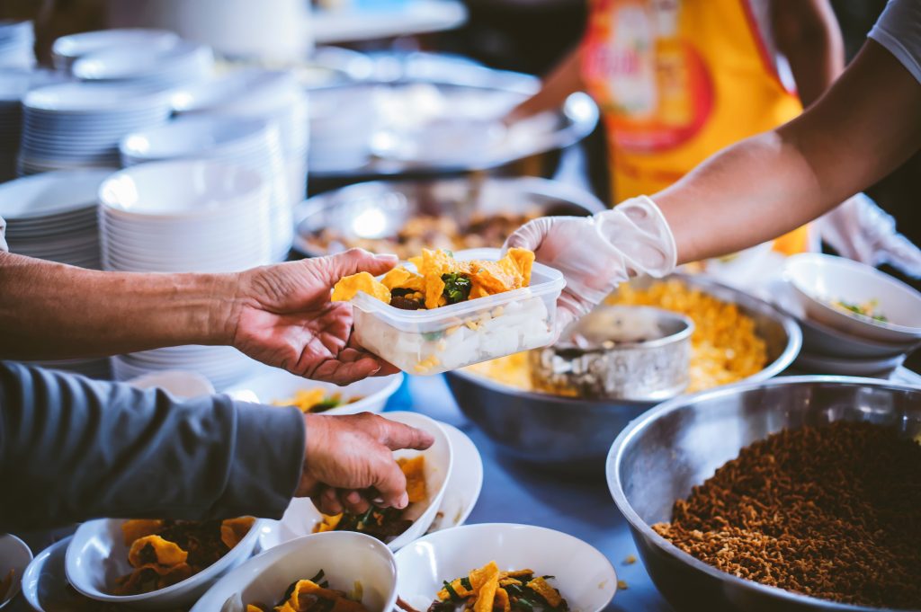 Charity food, Food for the poor hungry volunteers offering food to help the homeless : Concept of getting help from fellow humans