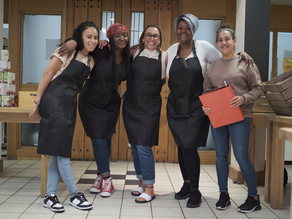 Portrait of volunteers working in community food center