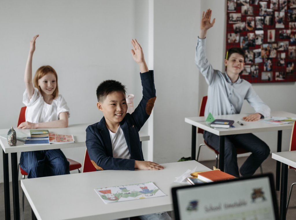 A group of young students engaged in a classroom setting
