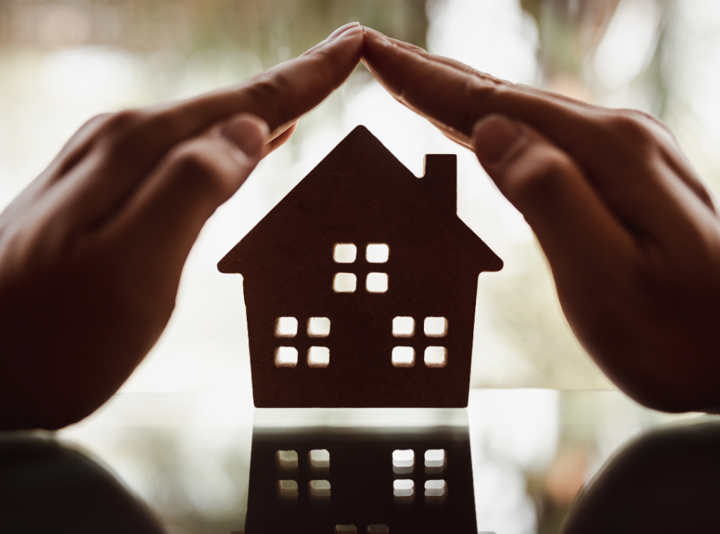 Hands covering home