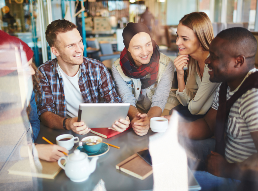 Mixed group of adults laughing, smiling and engaging